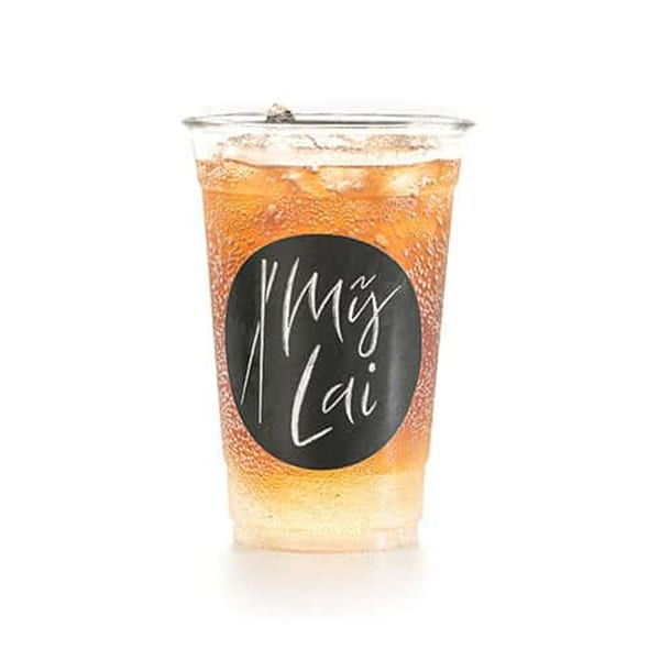 Iced tea in a clear plastic cup with a black My Lai logo sticker.